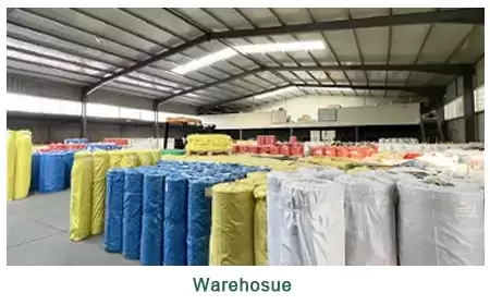 Neatly wrapped finished SBR, NBR, and EPDM rubber sheet rolls stacked in our factory warehouse for export.
