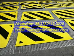 Heavy-duty anti-slip patterned rubber flooring Patterned rubber matting installed in a high-traffic industrial facility
