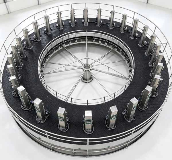 Circular rotary milking platform rubber mats installation Heavy duty black milking parlour rubber mats with custom width installed on a circular rotary milking platform deck